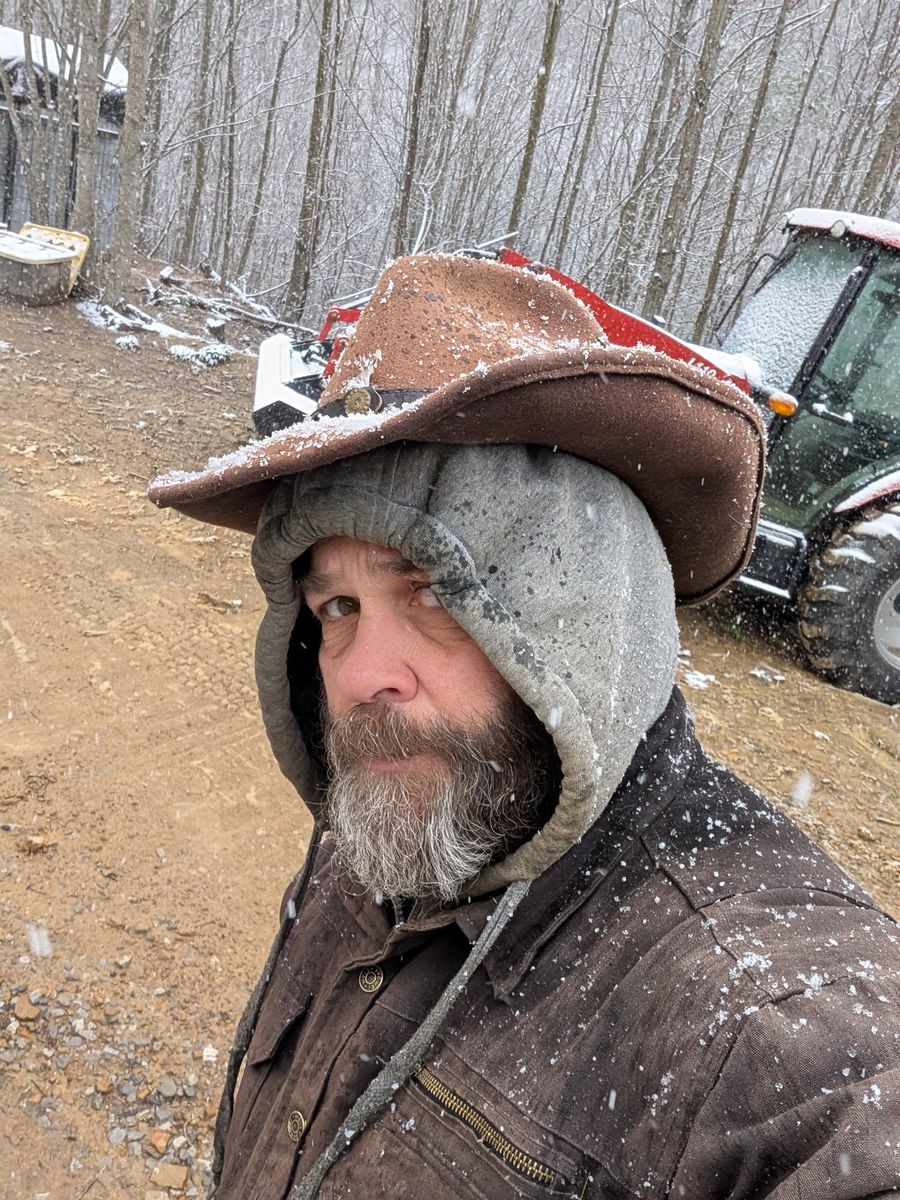 Chad in the snow with the tractor